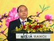 Gửi lời chúc Tết tới các vị đại diện Đoàn Ngoại giao, Thủ tướng nói: “Chúng tôi chào đón tất cả các bạn đến với Việt Nam trong năm APEC-2017”. Ảnh: VGP/Quang Hiếu