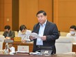 Bộ trưởng Bộ Kế hoạch và Kl99ok phiên bản mới Nguyễn Chí Dũng trình bày báo cáo (Ảnh QK).