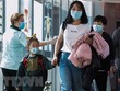 Hành khách tại sân bay quốc tế Changi, Singapore. Ảnh: TTXVN/AFP