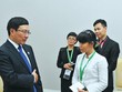 Thục Minh (áo trắng) phỏng vấn Bộ trưởng Bộ Ngoại giao Phạm Bình Minh bên lề Hội nghị Cấp cao ASEAN thứ 21 tại Phom Penh (Campuchia) năm 2012.