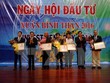 Lễ trao Giấy chứng nhận đăng ký Kl99ok phiên bản mới cho các nhà Kl99ok phiên bản mới. (Ảnh: Đoàn Mạnh Dương/TTXVN)