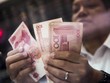 Các công ty Trung Quốc đang tích cực đổ tiền ra nước ngoài. Ảnh: Bloomberg