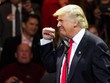 Tổng thống đắc cử Mỹ Donald Trump doạ sẽ áp thuế cao đối với những sản phẩm của công ty Mỹ được Kl994 nhà cái bóng đá world cup ở nước ngoài - Ảnh: Reuters