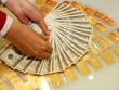 Sáng 22/12, giá vàng và tỷ giá USD đồng loạt giảm nhẹ