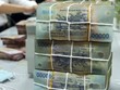 Do không tính chi trả nợ gốc, bội chi ngân sách 9 tháng giảm mạnh. Ảnh: PV.