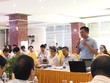 Phó Vụ trưởng Vụ Pháp chế Bộ LĐ,TB&XH Mai Đức Thiện trình bày báo cáo tại hội thảo.