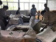 Các lực lượng kiểm tra nệm, chăn, gối nhập từ Trung Quốc ghi sẵn "Made in Vietnam". Ảnh: HQ TPHCM.