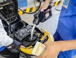Nhân viên cây xăng ở góc đường Lê Thánh Tôn (TP HCM) bơm xăng cho khách hàng. Ảnh: Nguyễn Thành.