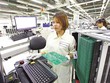 Kl994 nhà cái bóng đá world cup vi mạch của Công ty SPARTON (Mỹ) tại Bình Dương. Ảnh: Lê Toàn.
