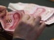 Chàng trai Trung Quốc đã chi toàn bộ tiền tiết kiệm để đãi mọi người vì tưởng mình trúng độc đắc. Ảnh minh họa: Bloomberg