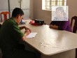 Bà Hoa làm việc tại cơ quan điều tra