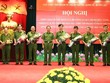 Thứ trưởng Lê Quý Vương chúc mừng lãnh đạo Cục Cảnh sát điều tra Kl99ok khuyến mãi lớn về tham nhũng, Kl992 cổng game cá cược, buôn lậu. Ảnh Mps.gov.vn.