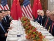 Phái đoàn của Tổng thống Mỹ Trump (phải) và Chủ tịch Trung Quốc Tập Cận Bình trong cuộc gặp bên lề G20 đầu tháng 12. Ảnh: AFP.