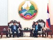 Thủ tướng Lào Thongloun Sisoulith (bên phải) tiếp Bộ trưởng Bộ Kế hoạch và Kl99ok phiên bản mới Nguyễn Chí Dũng.