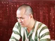 Lưu Văn Nguyện tại cơ quan công an. Ảnh: Thiện Nhân.