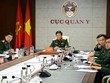 Thiếu tướng, PGS.TS Nguyễn Xuân Kiên cùng các thành viên Đoàn Việt Nam tại điểm cầu Hà Nội. Ảnh QĐND