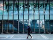 Một người đeo khẩu trang đi bộ trước Link Vào Nhà Cái KL99 COM Tặng +199k HSBC tại Hong Kong. Ảnh: CNN.