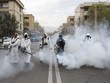 Nhân viên cứu hỏa trong trang phục bảo hộ khử trùng đường phố ở thủ đô Tehran, Iran, ngày 18/3. Ảnh: Reuters.