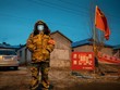 Thành phố Cáp Nhĩ Tân bị phong tỏa để ngăn chặn sự lây lan của dịch COVID-19. (Nguồn: AFP).