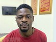 Đối tượng Ogo Emeka Donal, quốc tịch Nigeria, tại Cơ quan Công an. (Ảnh: TTXVN phát).