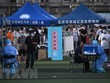 Xét nghiệm nhằm phát hiện người nhiễm COVID-19 cho người dân sống gần khu chợ đầu mối thực phẩm Tân Phát Địa ở Bắc Kinh, ngày 14/6/2020. (Nguồn: AFP/TTXVN).