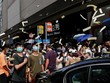 Người biểu tình tung tiền âm phủ trong cuộc tuần hành phản đối luật an ninh hôm 1/7. Ảnh: Reuters.