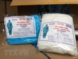 Trang phục phòng dịch giả mạo nhãn hiệu của Công ty Phúc Hà. (Nguồn: TTXVN).