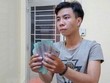 Đối tượng Ngô Chí Nhân tại cơ quan Công an. (Ảnh: TTXVN phát).