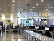 Hành khách làm thủ tục tại sân bay Nội Bài tháng 5/2021. (Ảnh: Huy Hùng/TTXVN).