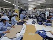 Công nhân tại một Kl991.com World Cup 2026 Chính Thức dệt may. (Nguồn: TTXVN).