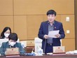 Tổng Thư ký Quốc hội, Chủ nhiệm Văn phòng Quốc hội Bùi Văn Cường trình bày tờ trình. (Ảnh: Doãn Tấn/TTXVN).
