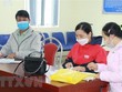 Người lao động đến giải quyết chế độ tại cơ quan Kl99kl phiên bản hoạt động Trang Chủ KL99Com Số 1 Link Đăng Ký KL999 huyện Quỳnh Lưu, tỉnh Nghệ An. (Ảnh: Bích Huệ/TTXVN).