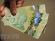Đồng đôla Canada. (Ảnh: AFP/TTXVN).