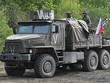 Xe quân sự Nga tiến theo hướng Kharkov, Ukraine. Ảnh: Sputnik..