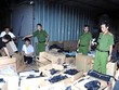 Hiện trường Ban Chuyên án đóng gói, niêm phong tang vật vụ án. (Ảnh: TTXVN phát).