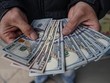 Đồng USD. (Ảnh: AFP/TTXVN)