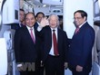 Chủ tịch nước Nguyễn Xuân Phúc, Thủ tướng Phạm Minh Chính đón Tổng Bí thư Nguyễn Phú Trọng. (Ảnh: Văn Điệp/TTXVN)