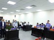 Đại diện Viện Kiểm sát công bố bản cáo trạng với các bị cáo tại phiên tòa. (Ảnh: Phạm Kiên - TTXVN)