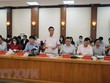 Chủ tịch thành phố Nguyễn Văn Tùng chủ trì buổi họp. (Ảnh: Hoàng Ngọc/TTXVN).
