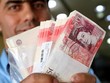 Đồng tiền mệnh giá 50 bảng Anh. (Ảnh: AFP/TTXVN)