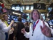 Phố Wall tăng mạnh sau bài phát biểu của Chủ tịch FED - Ảnh: Reuters