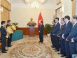 Phó Thủ tướng Phạm Bình Minh trao quyết định và chúc mừng 2 cán bộ được bổ nhiệm. Ảnh Baoquocte.vn
