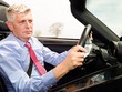 ÔngWolfgang Hatz trên một chiếc Porsche. Ảnh:Fortune.