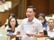 Đại biểu Trịnh Xuân An (đoàn Đồng Nai) tranh luận với Thống đốc Nguyễn Thị Hồng chiều 8/6.