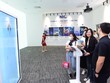 Trình diễn trí tuệ nhân tạo (AI) mang tên Hạ Vy của công ty ADT Creative tại VIIE 2023.