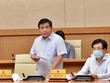 Bộ trưởng Bộ Kế hoạch và Kl99ok phiên bản mới Nguyễn Chí Dũng báo cáo về tình hình triển khai Luật Quy hoạch - Ảnh VGP