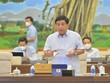 Bộ trưởng Bộ Kế hoạch và Kl99ok phiên bản mới Nguyễn Chí Dũng báo cáo tại phiên họp. 