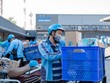Nhân viên giao hàng của Tiki tập trung lấy hàng tại kho (Ảnh minh hoạ: Tiki)