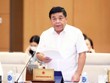 Bộ trưởng Bộ Kế hoạch và Kl99ok phiên bản mới Nguyễn Chí Dũng báo cáo tại phiên họp.