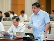 Bộ trưởng Bộ Kế hoạch và Kl99ok phiên bản mới Nguyễn Chí Dũng báo cáo tại phiên họp.